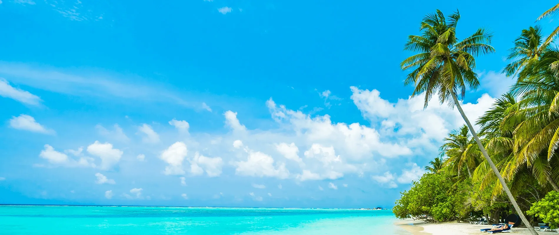 Overwater villas above a turquoise Maldivian lagoon