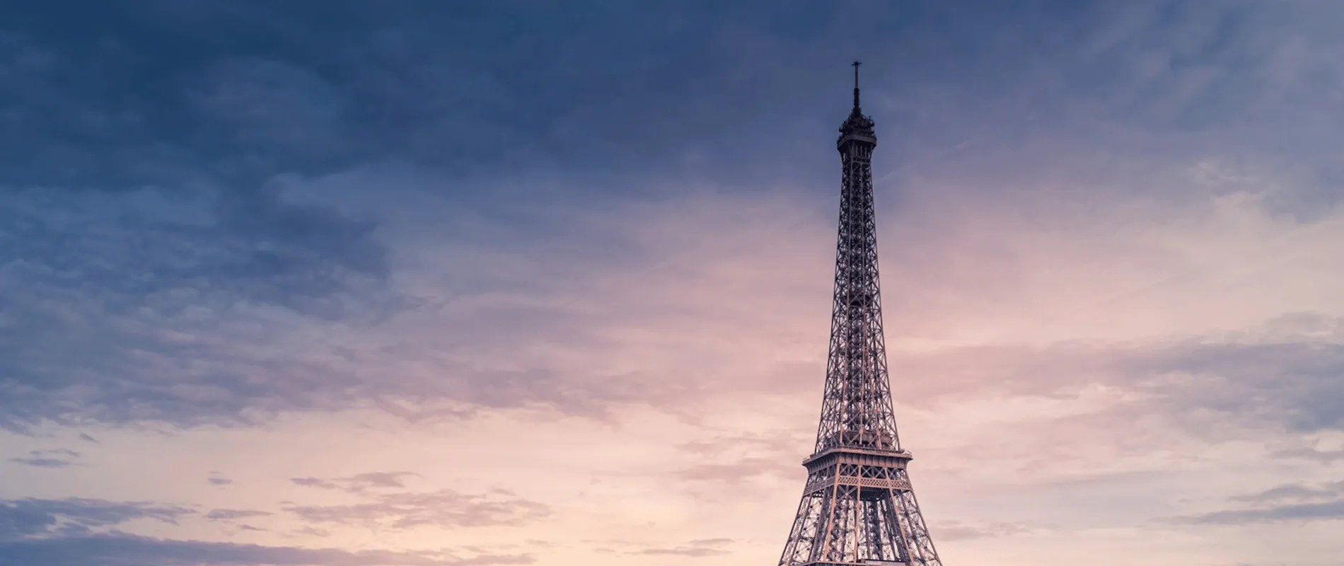 The Eiffel Tower over the Seine at twilight