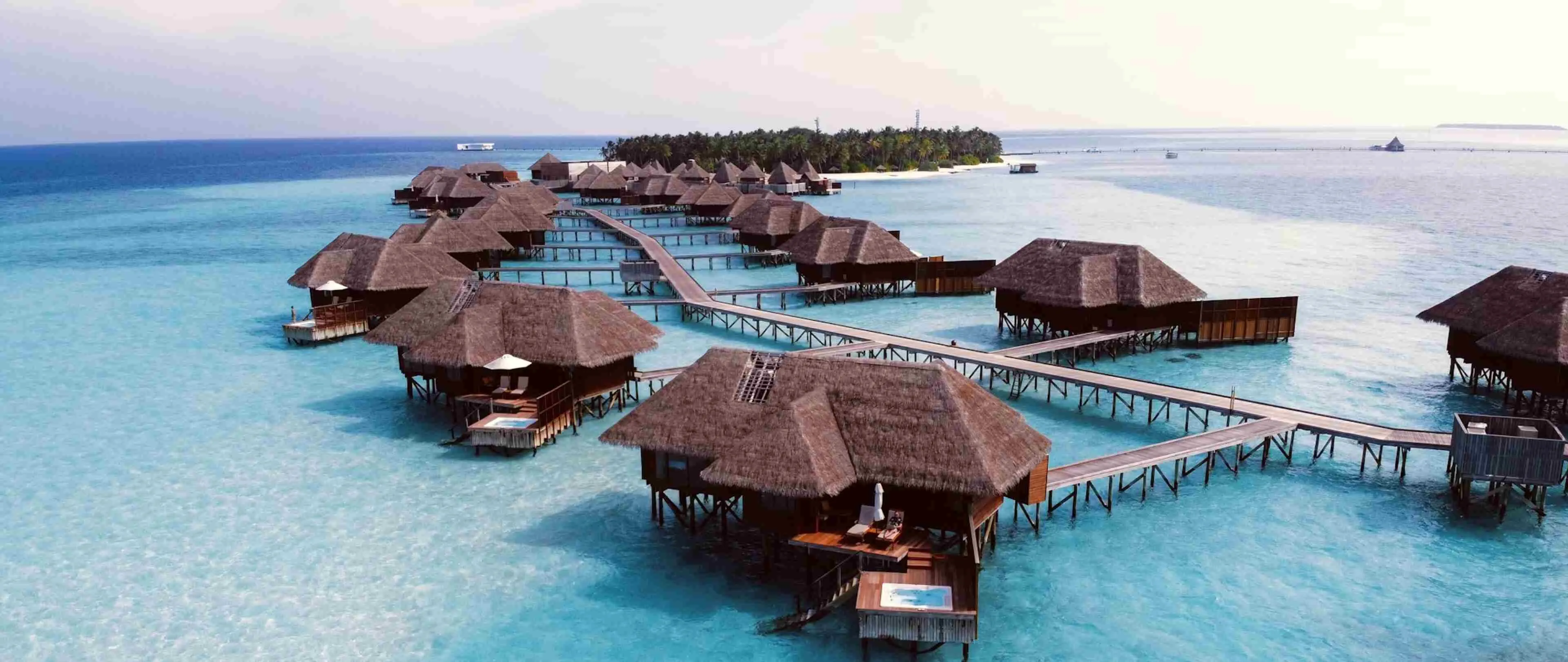 Overwater bungalow at sunset in the Maldives